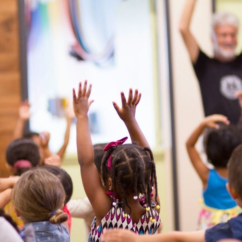 children lifting hands